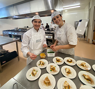 Lucy and Michelle plating dessert2